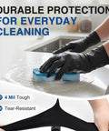 Hands wearing Heavy Duty Black Nitrile Gloves Built Tough For Medical And Industrial Work Top Shelf 4 Mil Disposable Shield while cleaning.