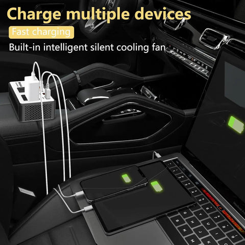 Road Tested 300W Car Power Inverter Converts 12V DC To 110V AC With No Sweat, charging multiple devices on car console.