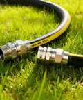 Solid Brass Five Eighths Inch Garden Hose Repair Kit with Heavy Duty Male and Female Ends on lawn