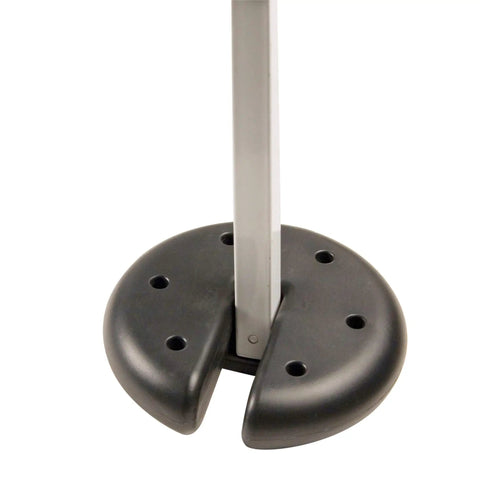 Close-up of 5-pound cement weight plate attached to a canopy leg for stability, featuring a black heavy-duty design and footings support.