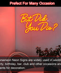 But Did You Die Neon Sign For Wall Decor Red LED Light With USB Power in a corner with a chair and plant, colorful lighting.