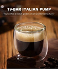 Glass cup of espresso with golden crema next to coffee beans, showcasing All In One Coffee Maker With Milk Frother For Espresso Cappuccino And Latte Automatic Brew System Permanent Filter No Paper Filters Needed Wake Up To Fresh Coffee Every Morning Easy To Use No Fuss Clean.