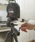 BT 150 Compact Tripod with Extendable Height for Line Lasers in use, showing adjustable handle and sturdy aluminum build