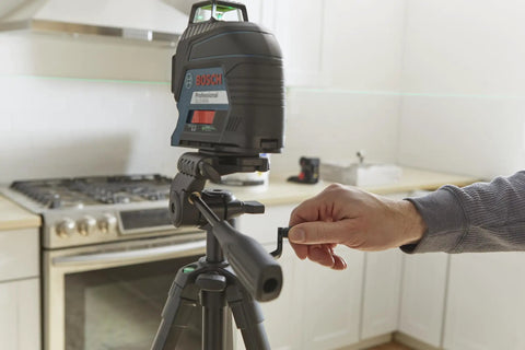 BT 150 Compact Tripod with Extendable Height for Line Lasers in use, showing adjustable handle and sturdy aluminum build