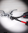Person using Beefy 3 Piece Slip Joint Pliers Set Alligator Pliers 7in for plumbing on bathroom faucet.