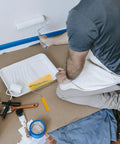 Person using a Heavy Duty Cotton Thread Paint Roller With Zero Hassle Grip And Smooth Roll Action on a wall.