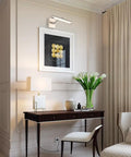 LED Picture Light With 24.4 Inch Swing Arm For Artwork Adjustable Up Down 180 Degrees Brushed Nickel Finish in a living room