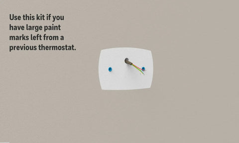 White Thermostat Wall Plate With Mount Bracket For 2x4 Electrical Box showing large cover plate on wall.