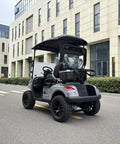 Dual Lithium Golf Carts With Built In Cup Holders Keeping Drinks Chilled Featuring Lightweight Electric Setup viewed from rear on street.