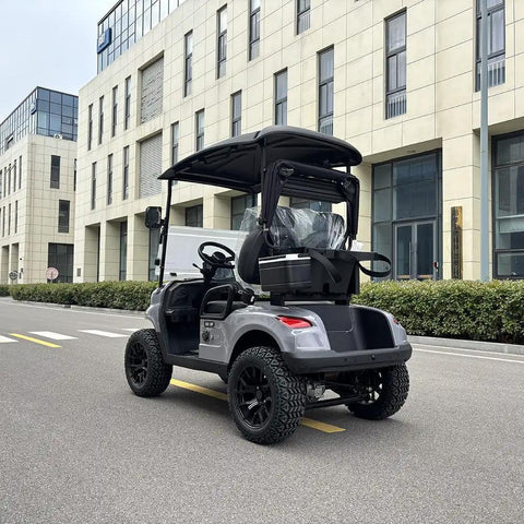 Dual Lithium Golf Carts With Built In Cup Holders Keeping Drinks Chilled Featuring Lightweight Electric Setup viewed from rear on street.
