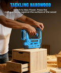 Person using Pro Grade 18 Gauge Cordless Brad Nailer 21V on wooden drawer, demonstrating straight shooting nail gun on hardwood.
