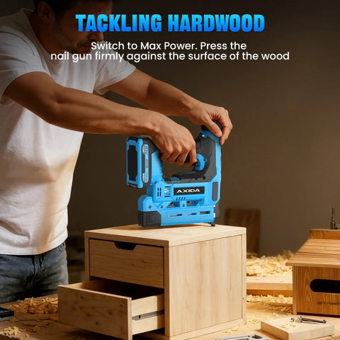 Person using Pro Grade 18 Gauge Cordless Brad Nailer 21V on wooden drawer, demonstrating straight shooting nail gun on hardwood.