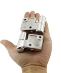 Hand holding Pair Of Stainless Steel 316 Marine Grade Heavy Duty Left And Right Lift Off Take Apart Hinges With Screws Three Point Five By One
