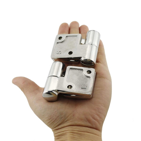 Hand holding Pair Of Stainless Steel 316 Marine Grade Heavy Duty Left And Right Lift Off Take Apart Hinges With Screws Three Point Five By One