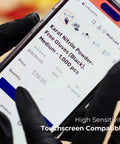Person using smartphone while wearing black nitrile gloves, emphasizing touchscreen compatibility, unrelated to Large 1000 Count Clear Vinyl Disposable Gloves Powder Free Great Fit Tear Resistant Multi Purpose For Cooking Food Prep And Janitorial DINP Free Ambidextrous Comfortable Grip.