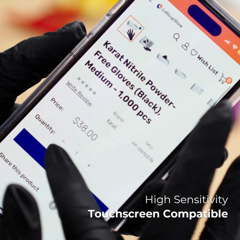 Person using smartphone while wearing black nitrile gloves, emphasizing touchscreen compatibility, unrelated to Large 1000 Count Clear Vinyl Disposable Gloves Powder Free Great Fit Tear Resistant Multi Purpose For Cooking Food Prep And Janitorial DINP Free Ambidextrous Comfortable Grip.