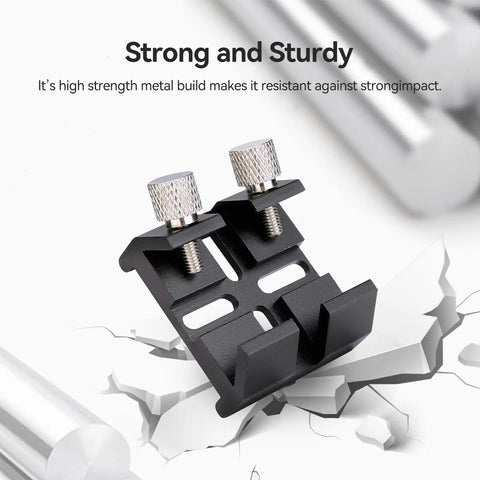 Universal Dovetail Base Finder Scope Mount Bracket on cracked surface, durable aluminum construction, for telescopes