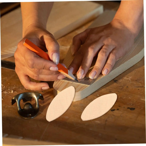 100 Piece Hardwood Biscuit Joiner Set for Woodworkers Tongue and Groove Board Carving Tenon Tool Kit in use marking wood.