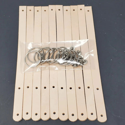 Ten Pack Of One Half Inch Natural Vegetable Tanned Leather Keychain Blanks Ready For Custom Stamping And Tooling with polished split rings.