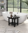 Black 22.8 Inch Shower Bench With Handles, Waterproof HIPS Stool With Storage Shelf And Non Slip Feet beside a white bathtub