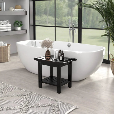 Black 22.8 Inch Shower Bench With Handles, Waterproof HIPS Stool With Storage Shelf And Non Slip Feet beside a white bathtub
