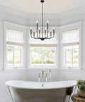 8 Light Black Farmhouse Chandelier Ceiling Light Fixture For Dining Room Modern Industrial Rustic Candle Hanging Lighting shown over bathtub