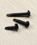 410 Stainless Steel No. 8 Self Drilling TEK Screws Assortment Kit with Black Oxide Finish, three lengths on wood surface