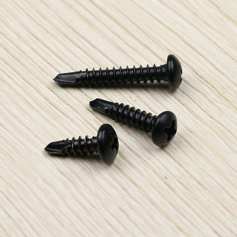 410 Stainless Steel No. 8 Self Drilling TEK Screws Assortment Kit with Black Oxide Finish, three lengths on wood surface