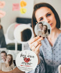Woman holding a 3-inch White Ceramic Ornament with a family photo for sublimation and heat press printing.