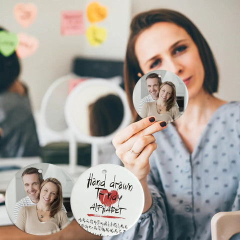 Woman holding a 3-inch White Ceramic Ornament with a family photo for sublimation and heat press printing.