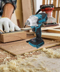 Heavy Duty Cordless Brushless Impact Wrench Kit With Rechargeable Battery, 520Nm Torque Quick Change Chuck on construction workbench.