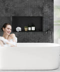 Modern bathroom with a woman in a bathtub and a Stainless Steel Shower Niche for Bathroom Storage, Recessed, No Tiling Required, 24x12 Inches, Antique Copper Finish.