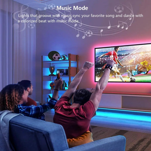 Room with RGB light strips highlighting TV and shelves, showing Under Cabinet LED Light Strips With Alexa And Google Home Voice Control.