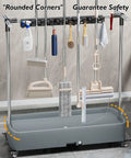 Stainless Steel Mop And Broom Rack With Removable Organizer Storage Tool Hooks And Slots For Home Garden Laundry And Garage Weatherproof Wall Mount Storage Holder Built To Last For Heavy Duty Use, shown holding cleaning tools with rounded corners.