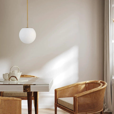 Mid Century Modern 1 Light Pendant Light With White Glass Globe Shade And Gold Finish Brushed Brass Fixture in dining area