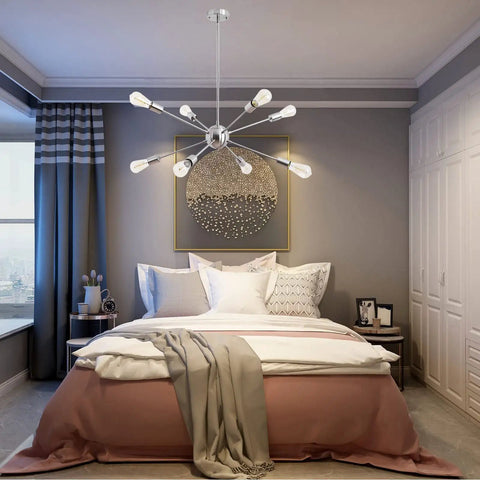 Sputnik Chandelier Light Fixture Chrome Finish Eight Light Ceiling Lamp for Living Room and Dining Room Modern Retro Style with Bright Ambient Illumination and a Totally Lit Satellite Design hanging over a bed in a modern bedroom.