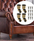 Four Piece Antique Brass Furniture Casters Crafted From Solid Cast Zinc Alloy Featuring Hella Smooth 360 Degree Swivel Rollers on a leather chair.