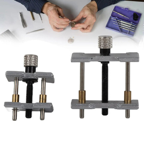 Pro Grade Watch Movement Holder Alloy Fixed Base Case Clamp Opening Durable Multi Function Watchmaker Tool For Precise Repairs Fits No 4039 B No 4040 A Movements Jewelry Making And Case Adjustments; visible two holders and watchmaker hands.