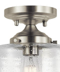 Close-up of Winslow 8.5 Inch Brushed Nickel Semi Flush Mount Light With Clear Seeded Glass, highlighting brushed nickel base.