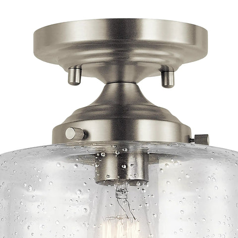Close-up of Winslow 8.5 Inch Brushed Nickel Semi Flush Mount Light With Clear Seeded Glass, highlighting brushed nickel base.