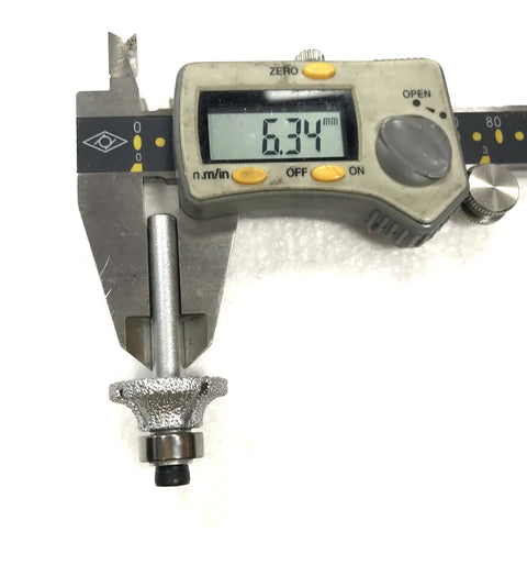 Measuring 6.34mm vacuum brazed diamond router bit 1/4 inch shank for marble granite and travertine for precise edge profiles.