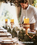 Wedding table with 24 Pack Flameless Votive Candles Tealights Warm White Ivory Base Christmas Decor arranged as centerpieces.