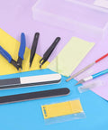 Ten Piece Model Tools Craft Set For Beginners To Pros Modeler Building Kit with tweezers, pliers, and files on a colorful surface.