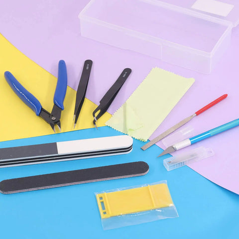 Ten Piece Model Tools Craft Set For Beginners To Pros Modeler Building Kit with tweezers, pliers, and files on a colorful surface.