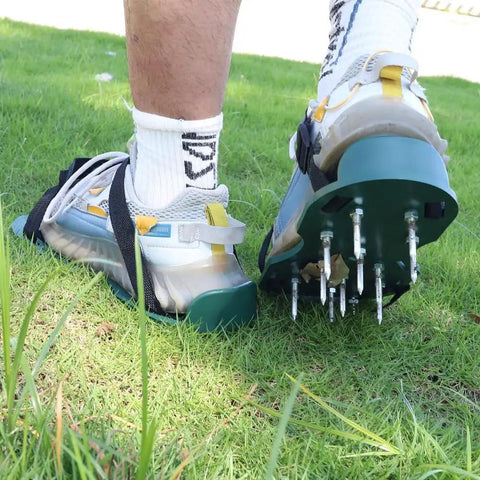 Person wearing adjustable lawn aerator shoes with 13 heavy nails for quick lawn aeration, spiked sandals for garden use.