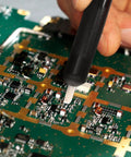 Using Six Piece Soldering Assist Set Desoldering Pump And Wick Kit For PCBs One Handed Solder Aid Tools on a circuit board