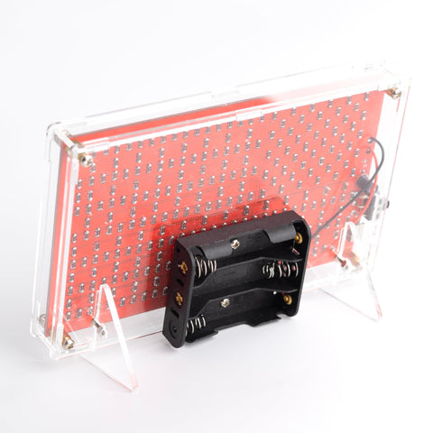 American Flag DIY Soldering Project Kit With Compact Acrylic Shell shown from the back with battery holder and SMD pads view.