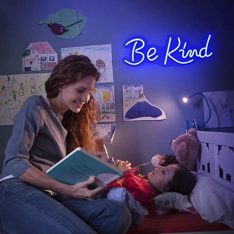 Mother reading bedtime stories with blue 'Be Kind' neon sign glowing in child's bedroom.