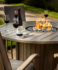 Outdoor fire table with flames from Diamond Fire Glass 10 Lbs 1 Inch High Luster Pro Grade Reflective Fire Pit Glass Rocks