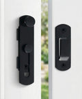 Barn Door Lock Set With Sliding Door Hardware In Carbon Steel Black Finish displayed on white door, showing latch and handle.
